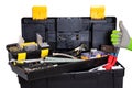 Tool box isolated. Black plastic tool kit box with assorted tools and a glove showing the thumb up sign for good work isolated on Royalty Free Stock Photo