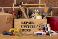 Tool box with repair, upcycle, mend stencil text Royalty Free Stock Photo