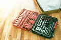 Tool box,set of bits and wrenches on laminated floor. Royalty Free Stock Photo