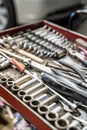 Tool box wagen. Toolset with wrenches, ring spanners, hammer, pliers, screwdrivers, monkey wrenches, screws, bolts, wire Royalty Free Stock Photo