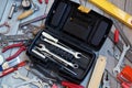 Tool box on wooden floor, view from above.