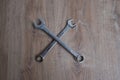 Tool crossed spanners on a wooden background. Royalty Free Stock Photo