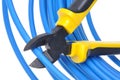 Tool pliers cutting blue cable Royalty Free Stock Photo