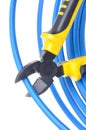 Tool pliers cutting blue cable Royalty Free Stock Photo