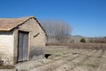 tool shed next to plowed land with leafless poplars in Fuente Vaqueros Royalty Free Stock Photo