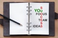 Tool of success words on organizer book with pencil