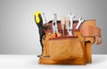 Tool belt with tools on background Royalty Free Stock Photo