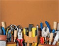 Tool belt with tools on wooden background Royalty Free Stock Photo