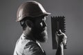 Tool, trowel, handyman, man builder. Mason tools, builder. Bearded man worker, beard, building helmet, hard hat Royalty Free Stock Photo