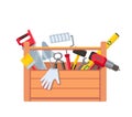 Toolbox with equipment. Wooden toolkit box with saw, drill, brush trowel and building level. House repair tools Royalty Free Stock Photo