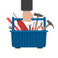 Toolbox in hand. Work tools in a blue box Royalty Free Stock Photo