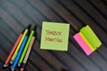 Toolbox Meeting write on sticky notes isolated on Wooden Table