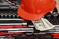 Toolbox, tools kit detail, dollar bills and orange protective helmet close up. instruments. set of tools. car tool kit. tool set