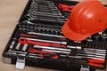 Toolbox, tools kit detail and orange protective helmet close up. instruments. set of tools. car tool kit. tool set background.