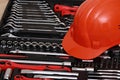 Toolbox, tools kit detail and orange protective helmet close up. instruments. set of tools. car tool kit. tool set background.