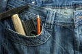 Toolkit of Three items in a blue jeans pocket.