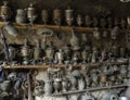 Toolmaker`s or metal craftsman`s workshop with copper container or vintage pots. Royalty Free Stock Photo