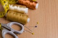Tools and accessories for sewing. Sewing thread, scissors, pins Royalty Free Stock Photo