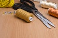 Tools and accessories for sewing. Sewing thread, scissors, pins Royalty Free Stock Photo