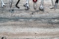 Tools, adjustable wrench, socket wrench, pliers on wood background, top view, flat lay