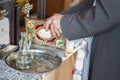 Tools for baby baptism. eley in the hands of a priest. Catholicism, the concept of Christianity