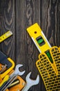 Tools in the bag for carpentry and accessories on a wooden dark vintage background Royalty Free Stock Photo