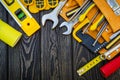 Tools in the bag for carpentry and accessories on a wooden dark vintage background Royalty Free Stock Photo