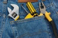 Tools in a blue jean pocket