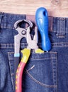 Tools in blue jeans pocket Royalty Free Stock Photo