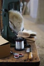 Tools of a brushmaker and broom binder, as scissors, yarn, comb, bunch, hair and bristles at a craft market, vertical