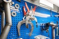 Tools of Car mechanic for a new piston for the engine, overhaul. Interior of a car repair shop.