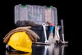 Tools in the chest and helmet of the production worker. Accessories for workers in the workshop Royalty Free Stock Photo