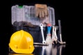 Tools in the chest and helmet of the production worker. Accessories for workers in the workshop Royalty Free Stock Photo