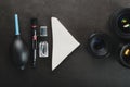 Tools for cleaning the camera with lenses on a dark textured background Royalty Free Stock Photo