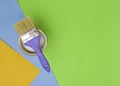 Tools for construction and decoration. A paintbrush and a metal can of paint. Bright background, top view Royalty Free Stock Photo