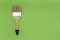 Tools for construction and decoration. Painting. Paint brush with wooden handle on a bright background. Top view, free space Royalty Free Stock Photo