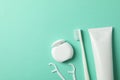 Tools for dental care on mint background