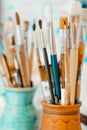 Tools and equipment for the artist. Palette and brushes close-up. The process of drawing and creativity. The picture is Royalty Free Stock Photo
