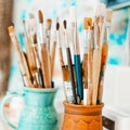 Tools and equipment for the artist. Palette and brushes close-up. The process of drawing and creativity. The picture is Royalty Free Stock Photo