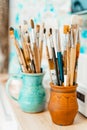 Tools and equipment for the artist. Palette and brushes close-up. The process of drawing and creativity. The picture is Royalty Free Stock Photo