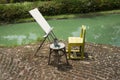 Tools and equipments easel drawing and canvas painting beside lake pond for thai people artist sketching drafts image in garden