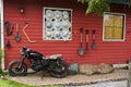 Tools and equipments farm gardening on red wooden wall of barn farmhouse for farmer use growing cultivating horticulture at meadow Royalty Free Stock Photo