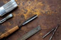 Tools, chisels, paintbrushes, flat lay on textured surface Royalty Free Stock Photo