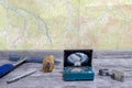 Tools geologist laid out on a wooden table on the background of a topographic map. Background Royalty Free Stock Photo