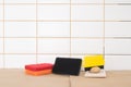 Tools for grouting on a white ceramic tile wall, on top there is a place for your inscription Royalty Free Stock Photo