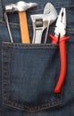 Tools in jeans pocket Royalty Free Stock Photo