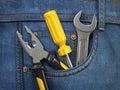 Tools in jeans pocket. Service and engineering concept