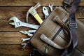 Tools in leather bag - labor day and business fight background c