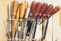 Tools and leather at cobbler workplace. Set of leather craft tools on wooden background Royalty Free Stock Photo