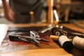 Tools for leather working on desk Royalty Free Stock Photo